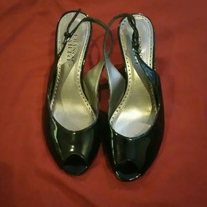 Black pantent leather low heels.